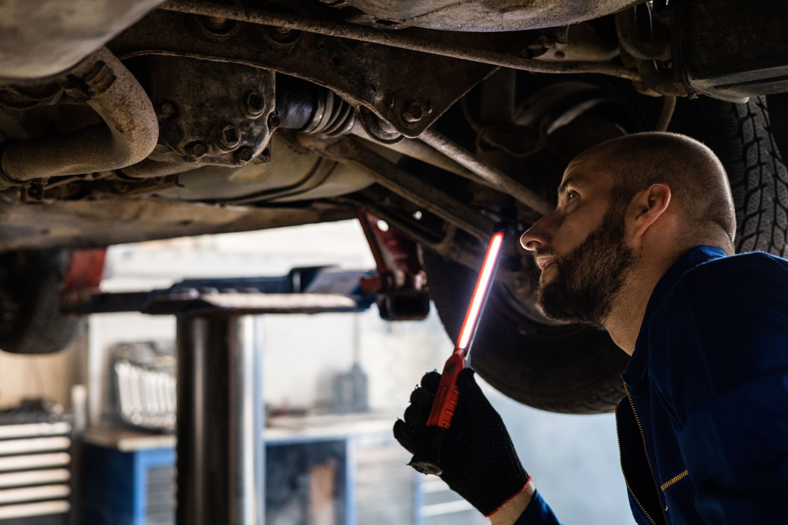 Technician assessing hidden damage that affects repair costs