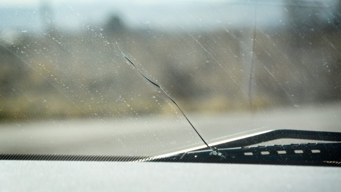 A car windscreen crack caused by a stone chip which needs a professional repair.