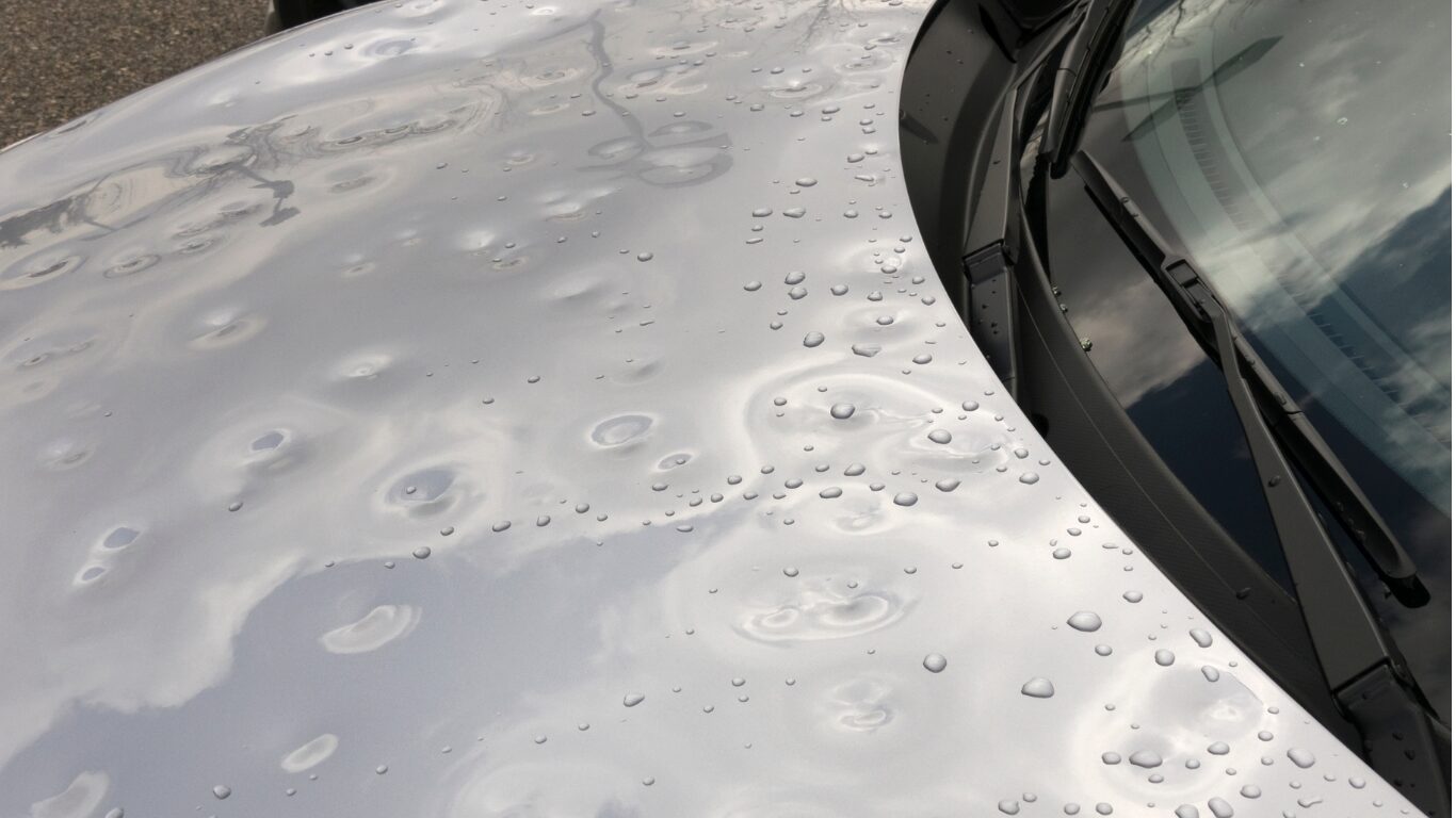 Hail damage on front bonnet of car.
